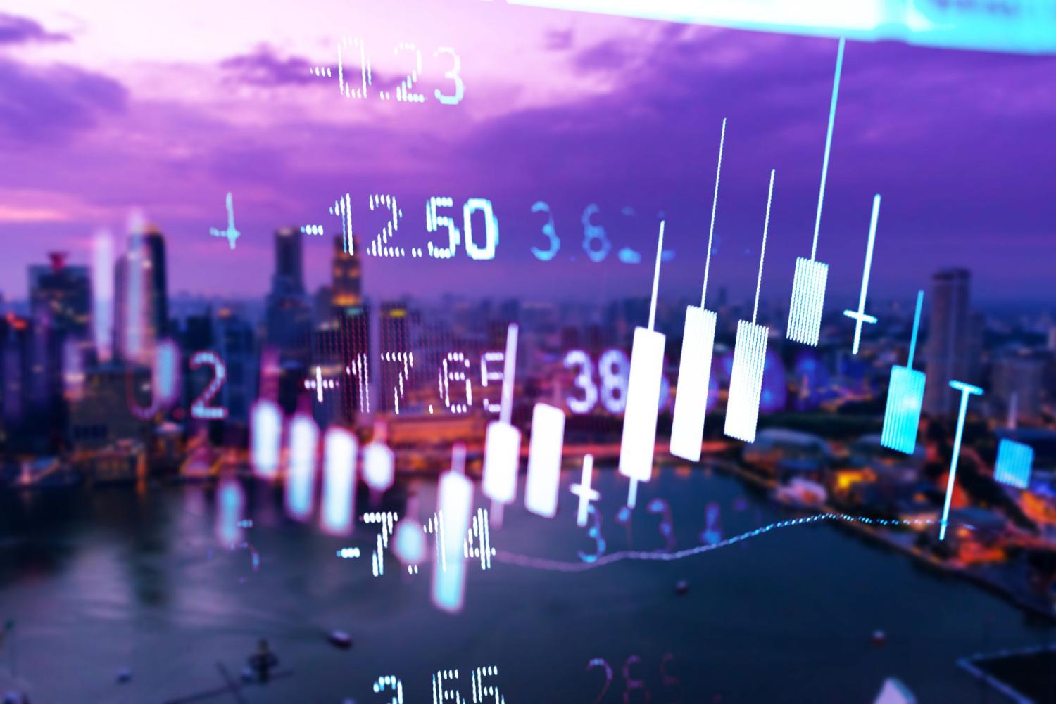 Candlestick graph laid over a city skyline