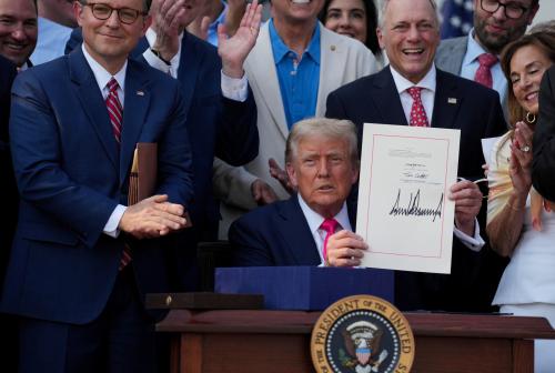 U.S. President Donald Trump presents a sweeping spending and tax legislation, known as the "One Big Beautiful Bill Act," after he signed it, at the White House in Washington, D.C, U.S., on July 4, 2025.